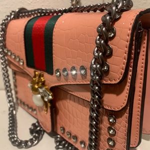 Pink snakeskin bee purse